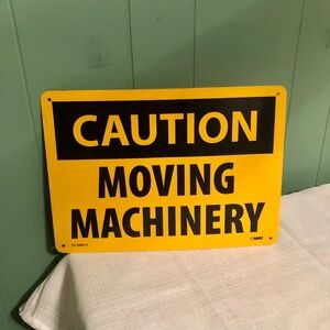 Caution Moving Machinery Yellow Tin Metal Safety Sign OSHA CU336015 NMC Man Cave